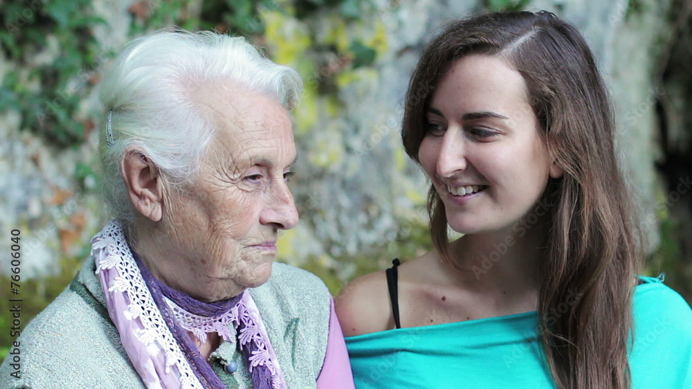 happy senior grandmother and adult granddaughter closeup portrait happy senior grandmother and adult granddaughter closeup portrait