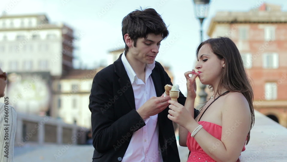 bad joke - girl spreads ice cream cone in the face of a boy - laughing bad joke - girl spreads ice cream cone in the face of a boy - laughing