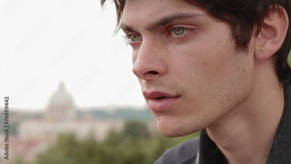 sad and pensive man - saint peter in background sad and pensive man - saint peter in background