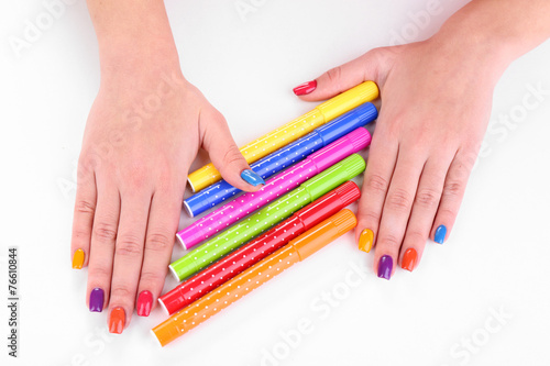 Multicolor female manicure with markers isolated on white