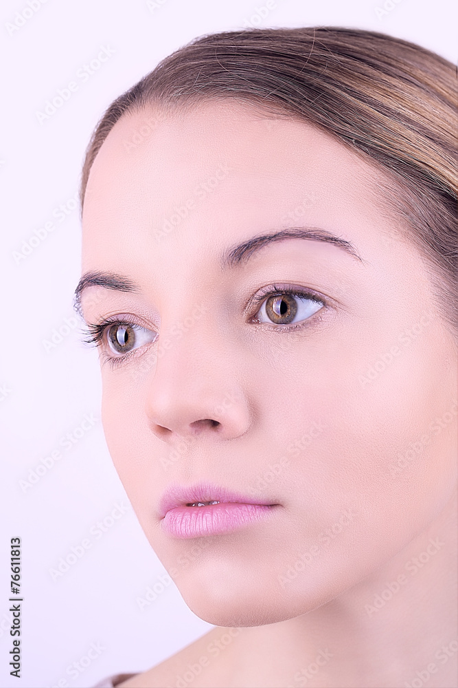 Applying makeup on female face, on white background Applying makeup on female face, on white background