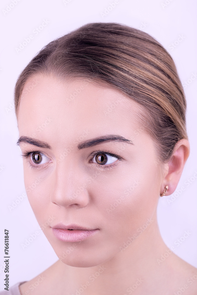 Applying makeup on female face, isolated on white Applying makeup on female face, isolated on white