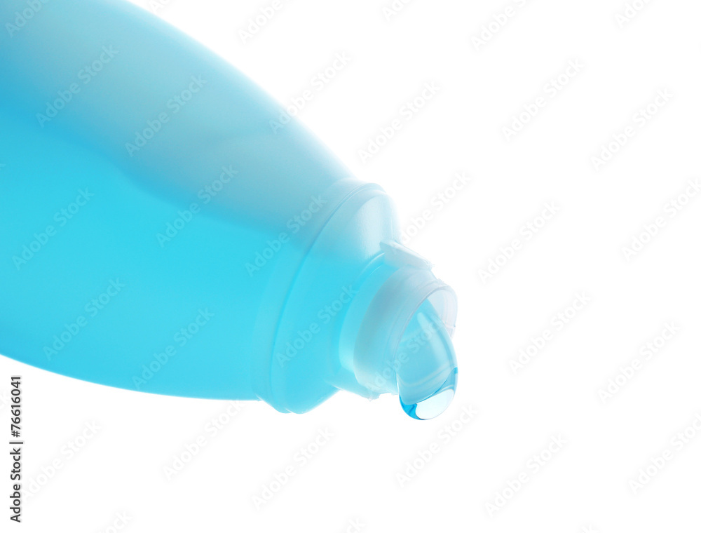 Cosmetic liquid pouring from bottle isolated on white Cosmetic liquid pouring from bottle isolated on white