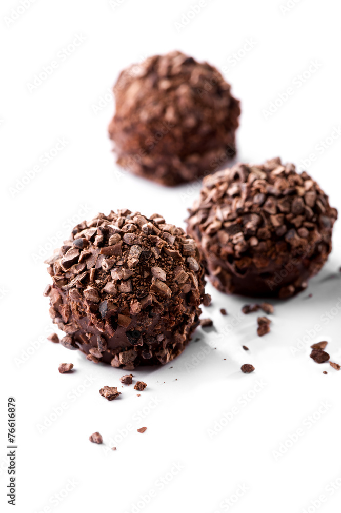 chocolates with crumbs close-up on white background chocolates with crumbs close-up on white background