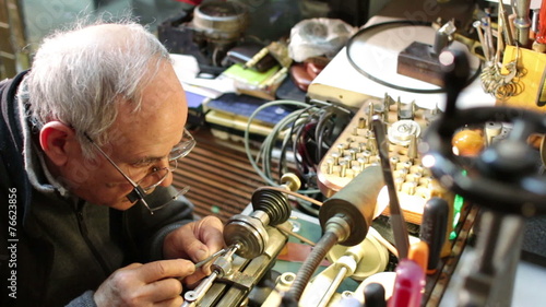 watchmaker working with the lathe photo