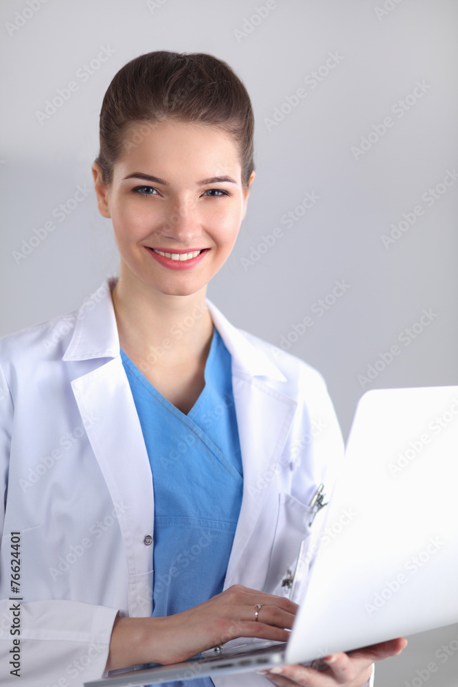 Portrait of young woman doctor standing in hospital Portrait of young woman doctor standing in hospital