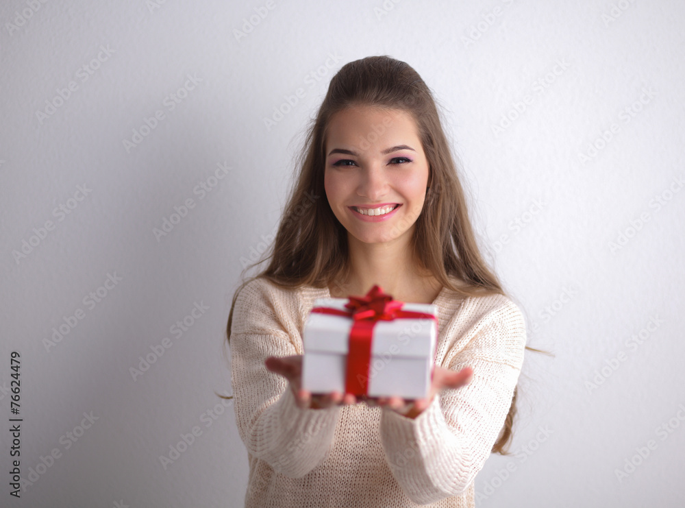 Young woman happy smile hold gift box in hands,standing over Young woman happy smile hold gift box in hands,standing over