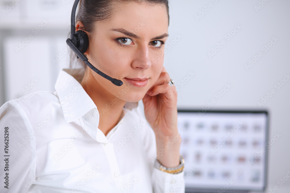 Close-up portrait of a customer service agent sitting at office Close-up portrait of a customer service agent sitting at office