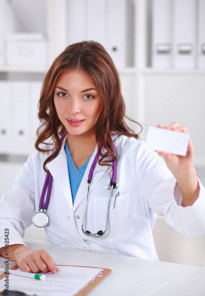 female doctor holding an empty card, isolated on white female doctor holding an empty card, isolated on white