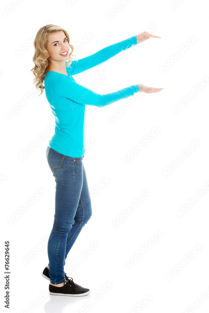 Woman showing something or copyspase Woman showing something or copyspase