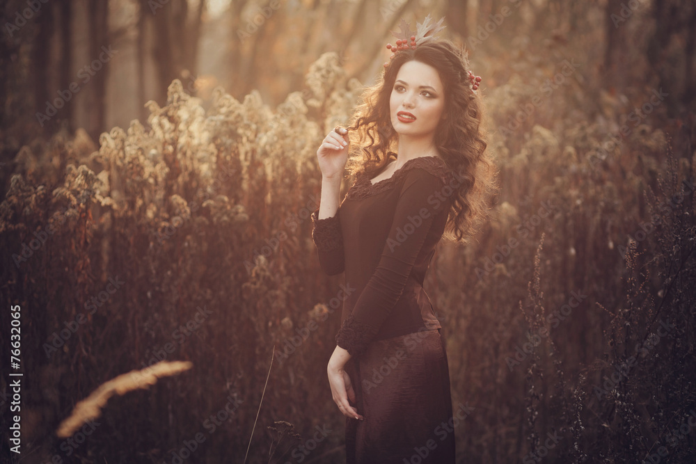 Fototapeta premium Young tender woman admires the sunset