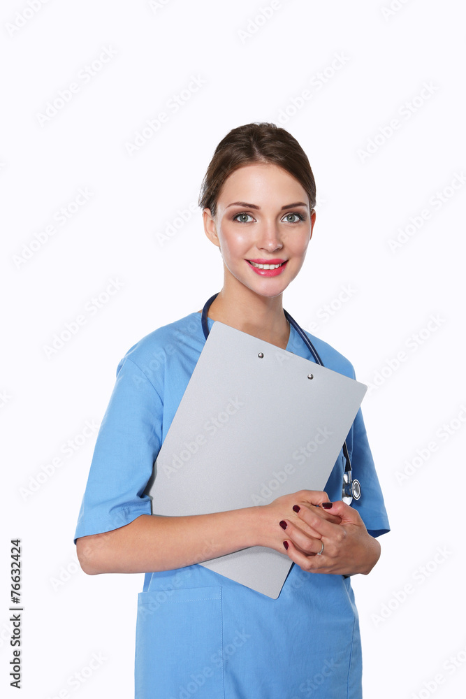 Smiling female doctor with a folder in uniform standing at Smiling female doctor with a folder in uniform standing at