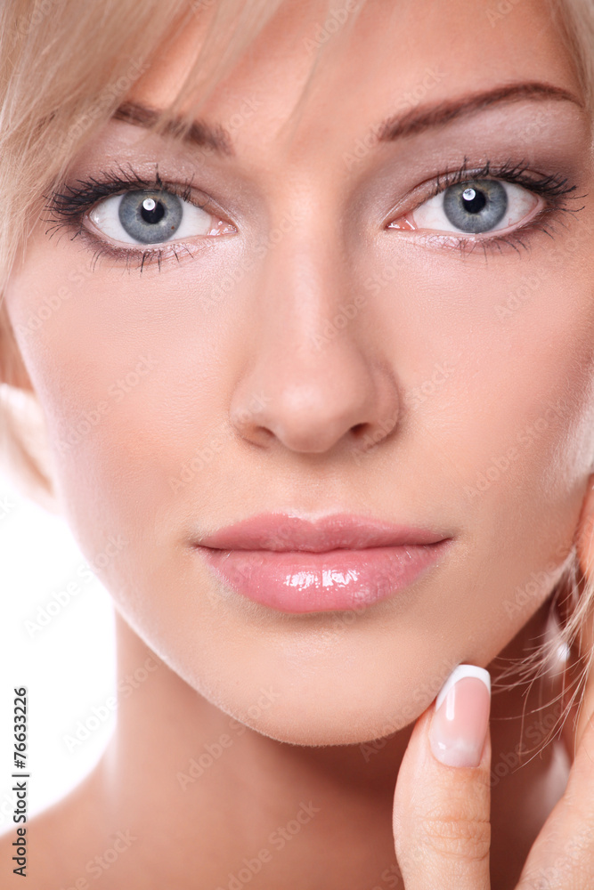 Portrait of young woman touching her face isolated on white Portrait of young woman touching her face isolated on white