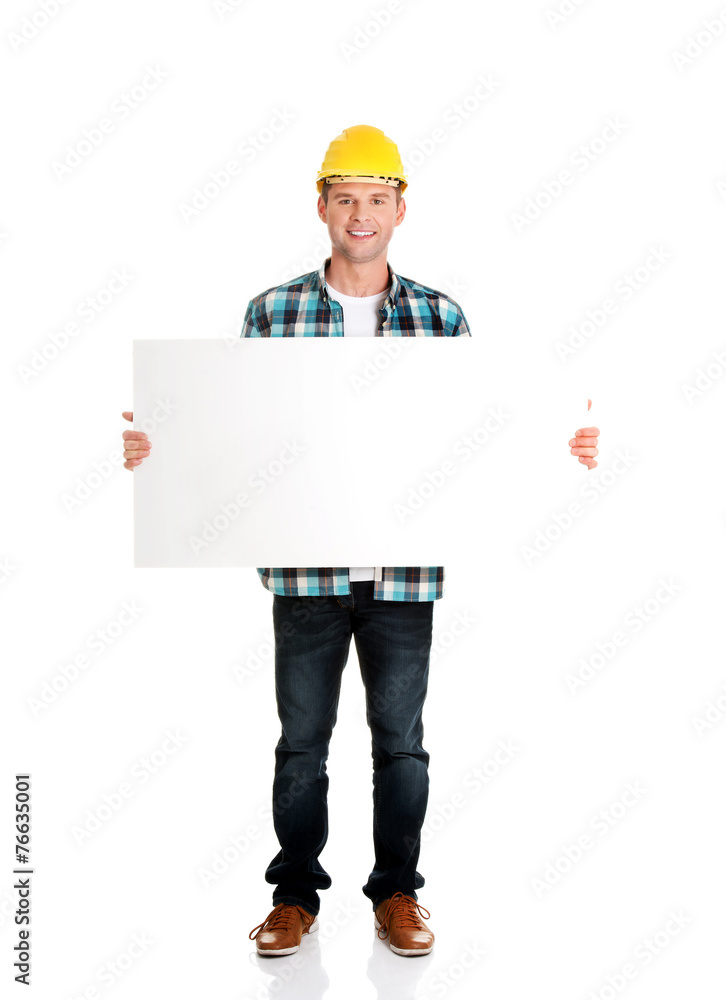 Happy worker presenting empty banner. Happy worker presenting empty banner.