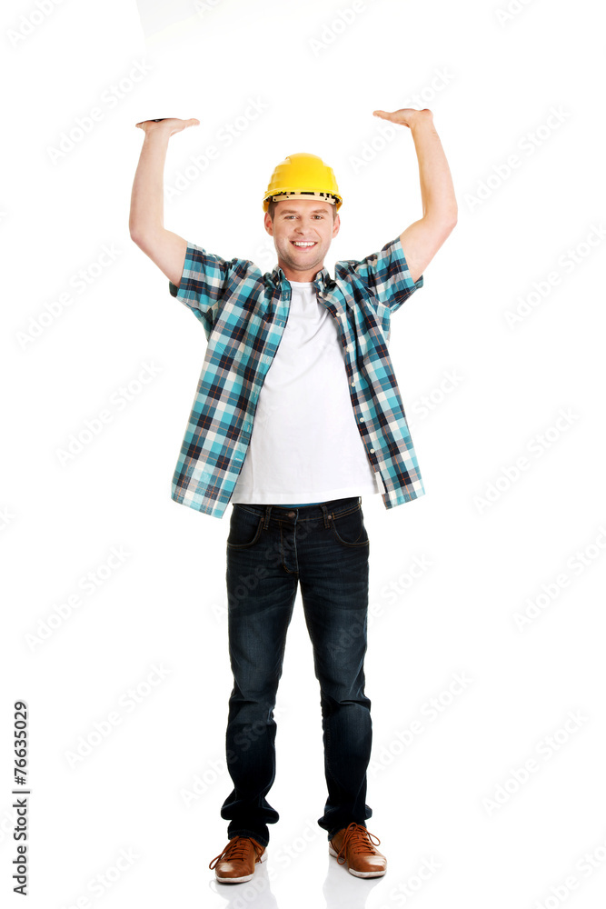 Happy worker presenting empty banner. Happy worker presenting empty banner.