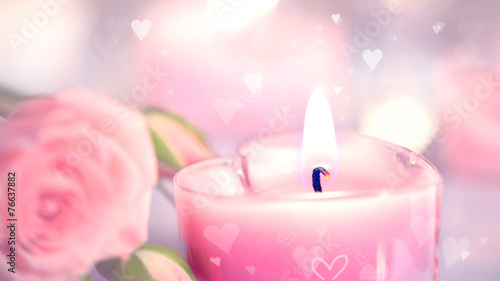 Valentine's Day. Pink heart shaped candles and rose flowers