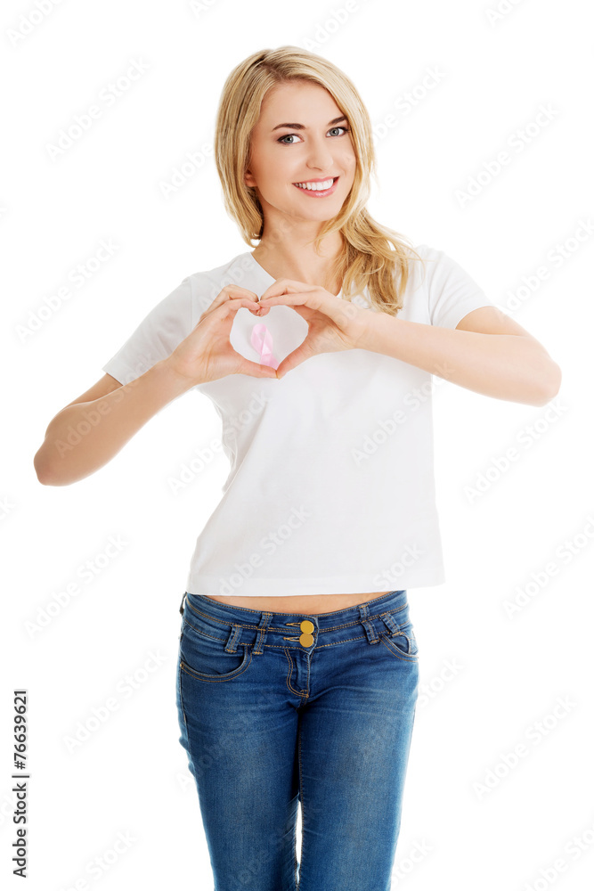 Woman with pink breast cancer awareness ribbon Woman with pink breast cancer awareness ribbon