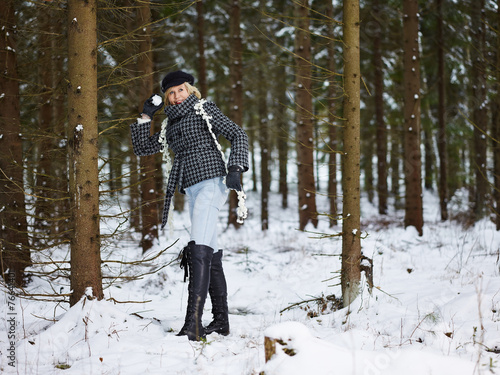 Fashionable woman and winter clothes - rural scene