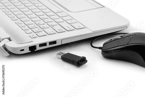 Closeup of USB Flash drive and laptop