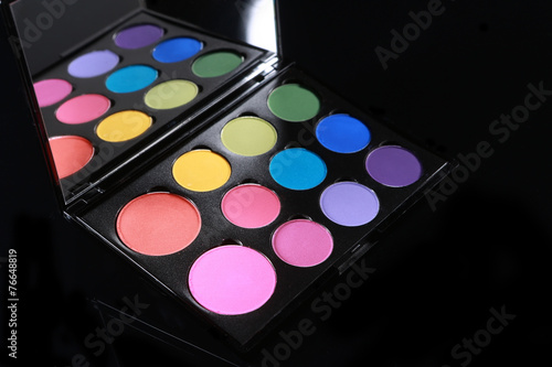 Colorful Palette of Various Eyeshadows on Black Background