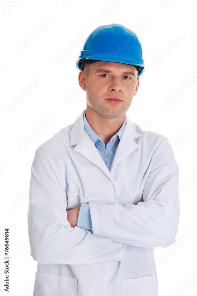 Man in a lab coat and helmet