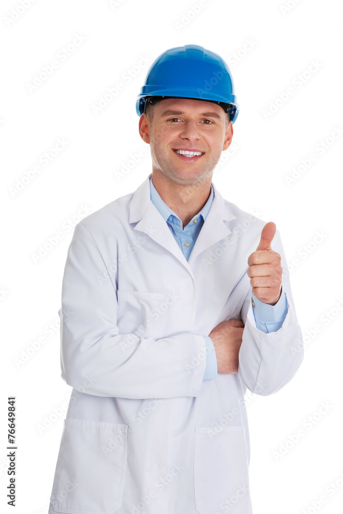 Man in a lab coat and helmet