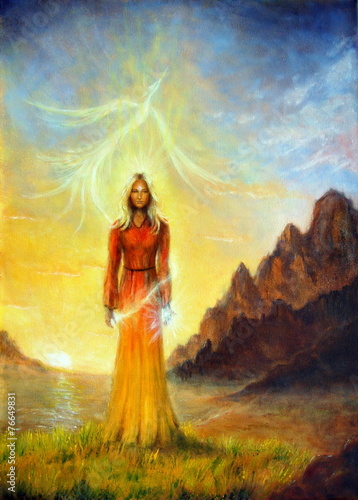 Fotografie An enchanting mystical priestess with a sword of light in a land