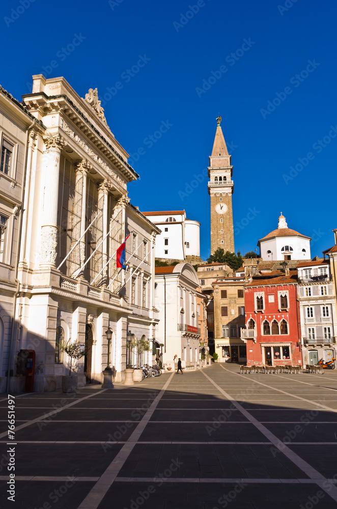 Fototapeta premium Bell tower and buildings at Tartini square in Piran, Istria