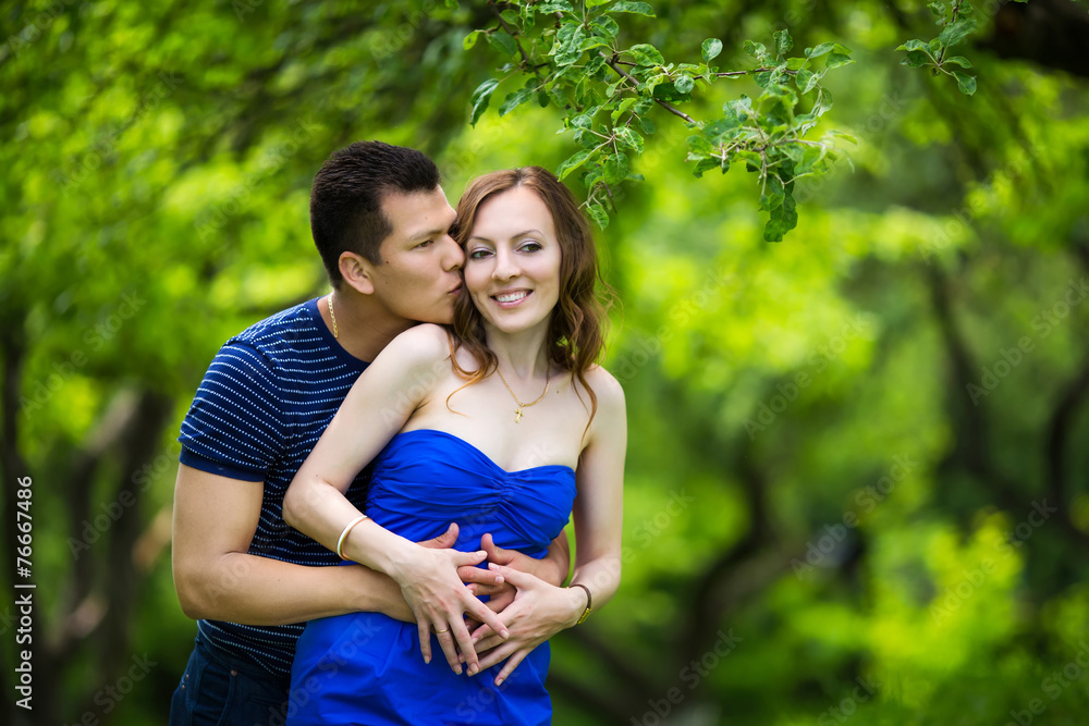 Fototapeta premium loving couple are hugging in park
