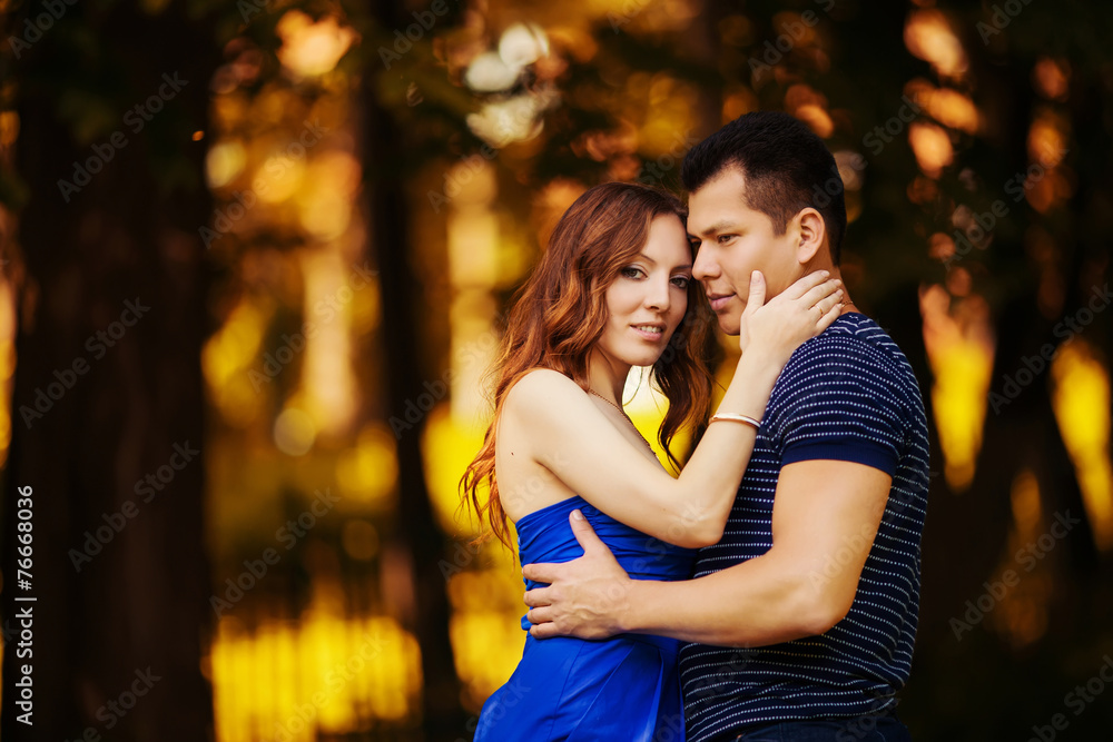 Fototapeta premium loving couple are hugging in park