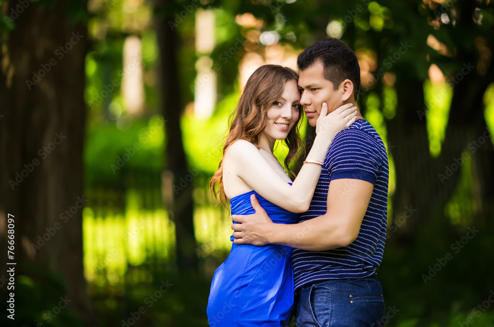 loving couple are hugging in park loving couple are hugging in park