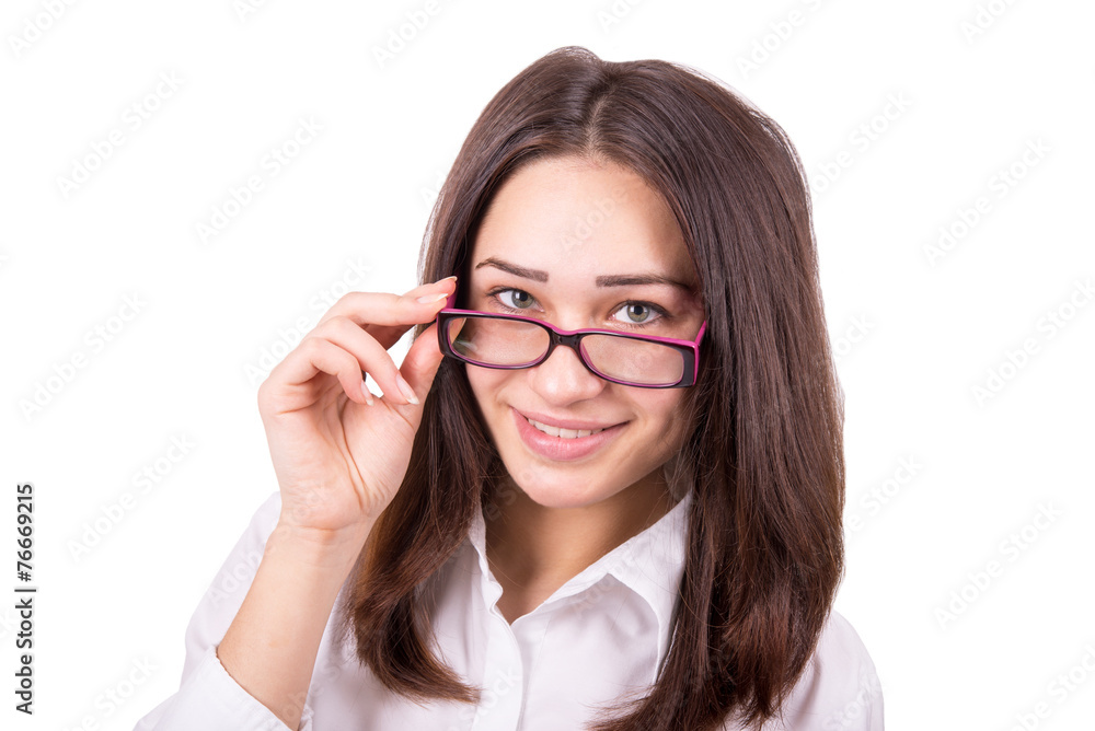 young business woman looking over glasses young business woman looking over glasses