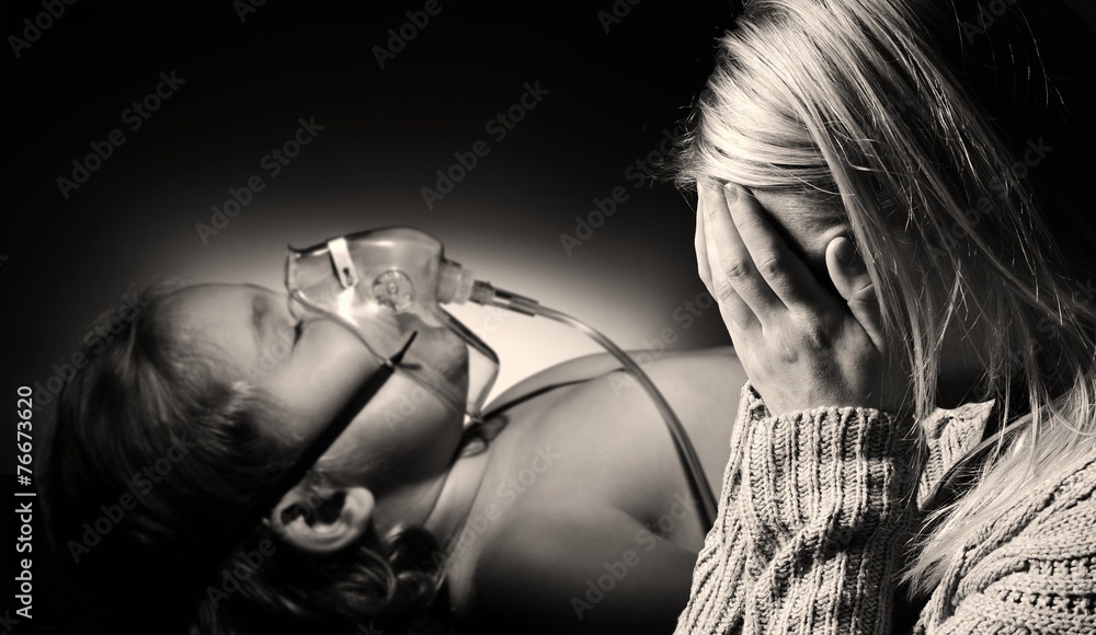 Mother prays for the health of seriously ill daughter.