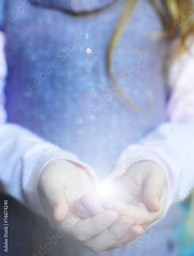 The light in young woman hands