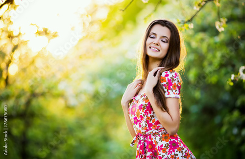 beautiful girl smiling in green park