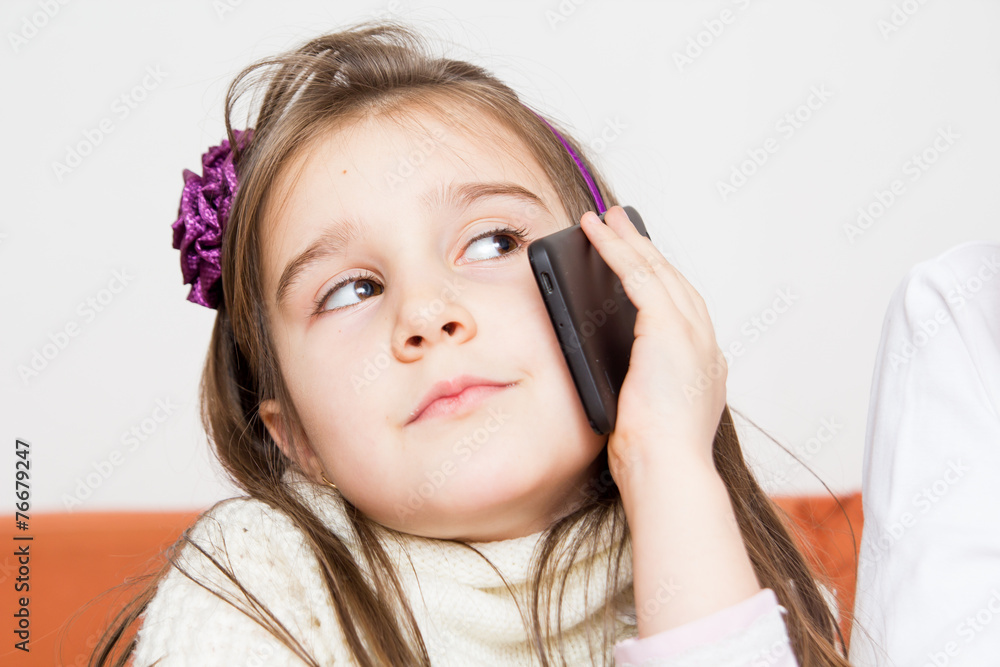 Little girl using mobilephone