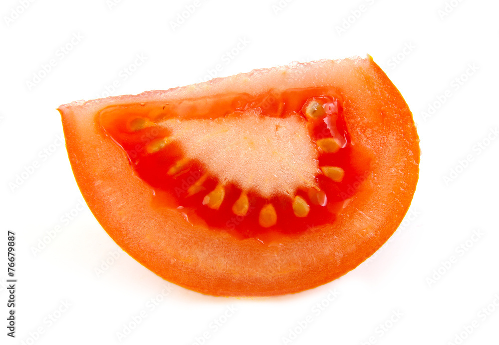 One slice of tomato on white background. One slice of tomato on white background.