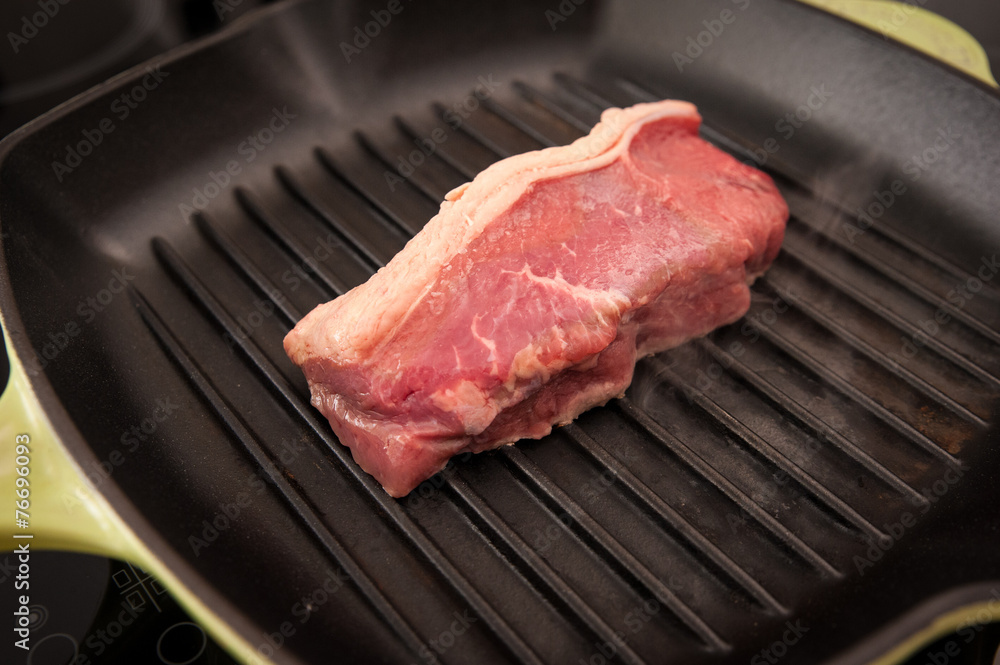 Rare beef rump steak on a griddle pan Rare beef rump steak on a griddle pan
