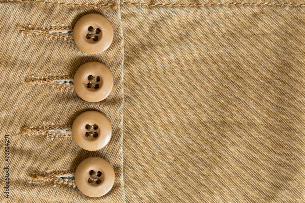 design botton of brown shirt on fabric textile background