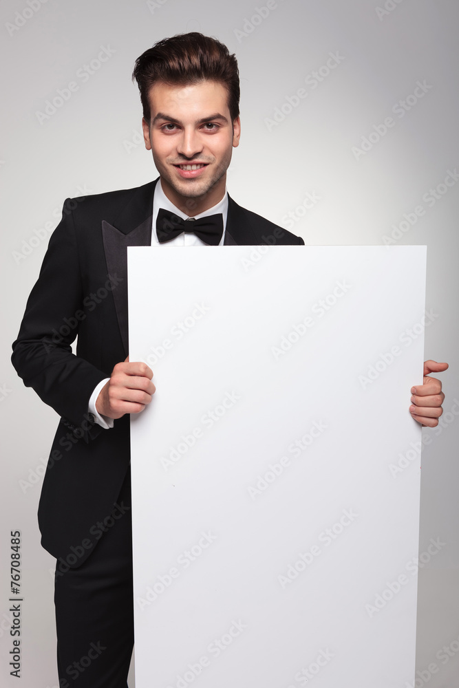 Handsome business man smiling at the camera Handsome business man smiling at the camera