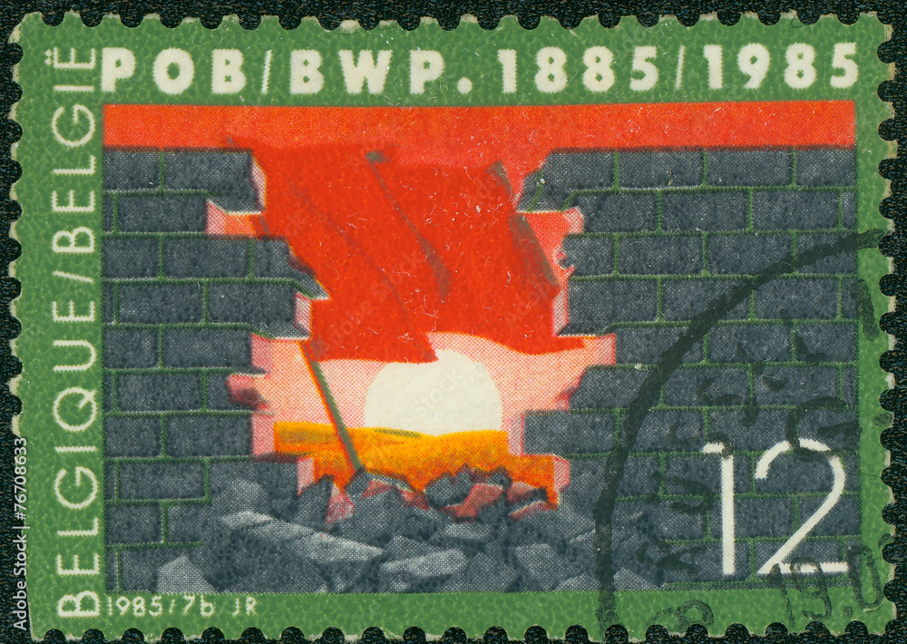 The broken wall. A red flag against the sun The broken wall. A red flag against the sun