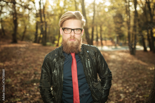 casual fashion man walking in the park