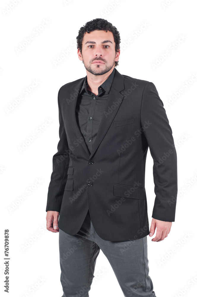 Young man in black jacket poses at studio Young man in black jacket poses at studio