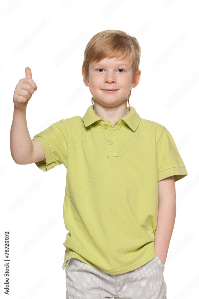 Handsome young boy shows his thumb up Handsome young boy shows his thumb up