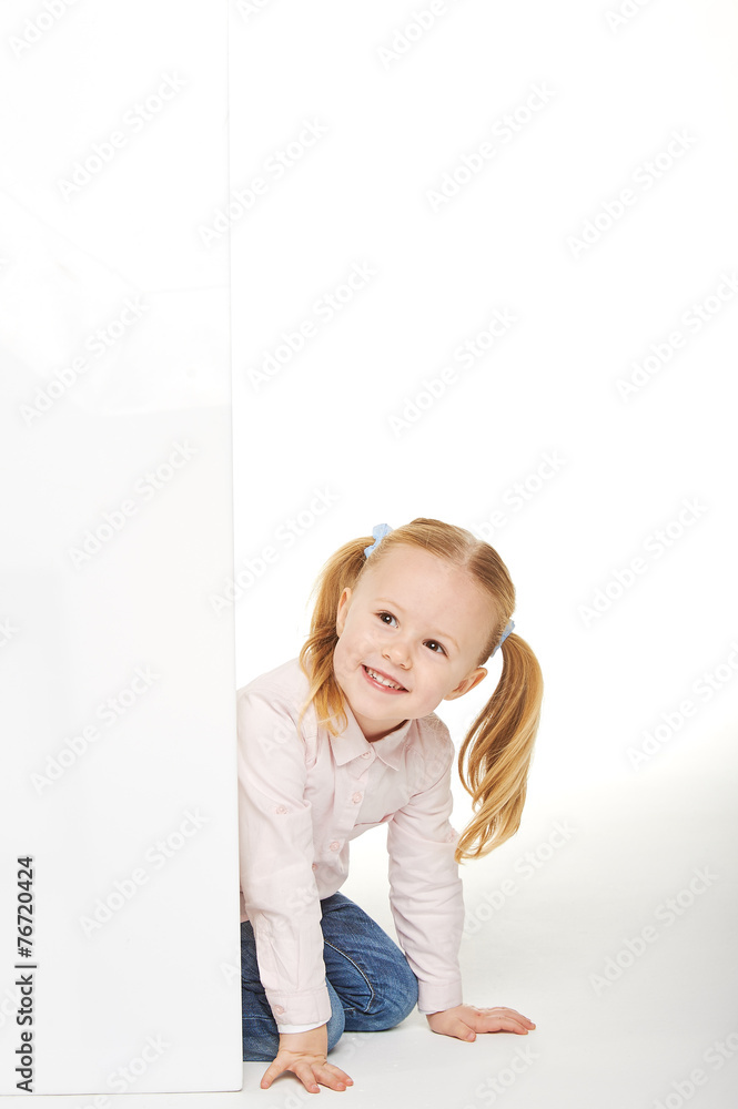 Beautiful little girl with white copy space on a white backgroun Beautiful little girl with white copy space on a white backgroun