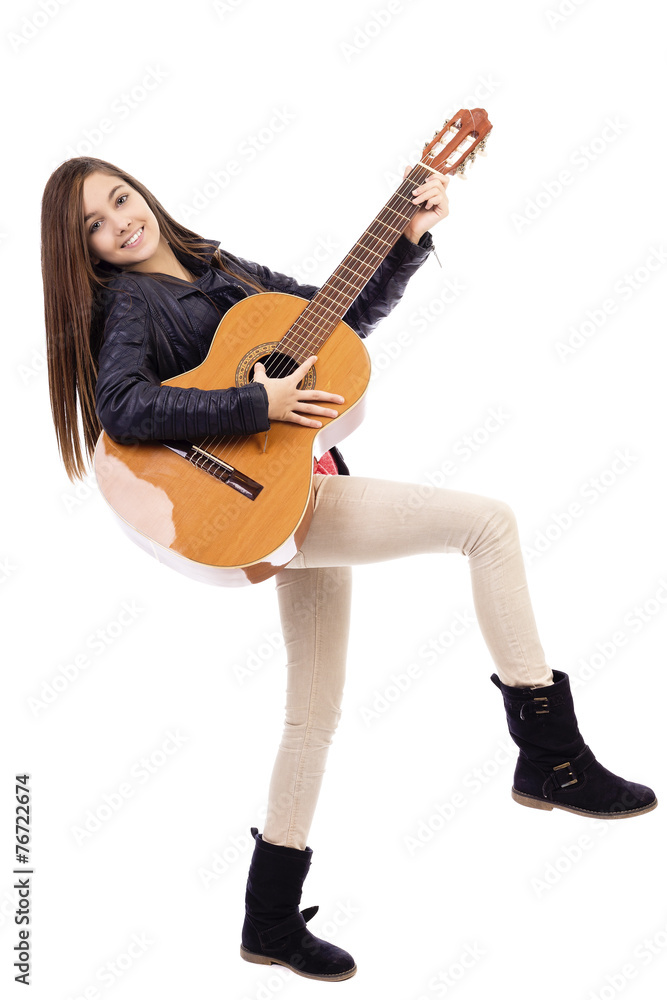 Full length portrait of happy teenage girl playing guitar