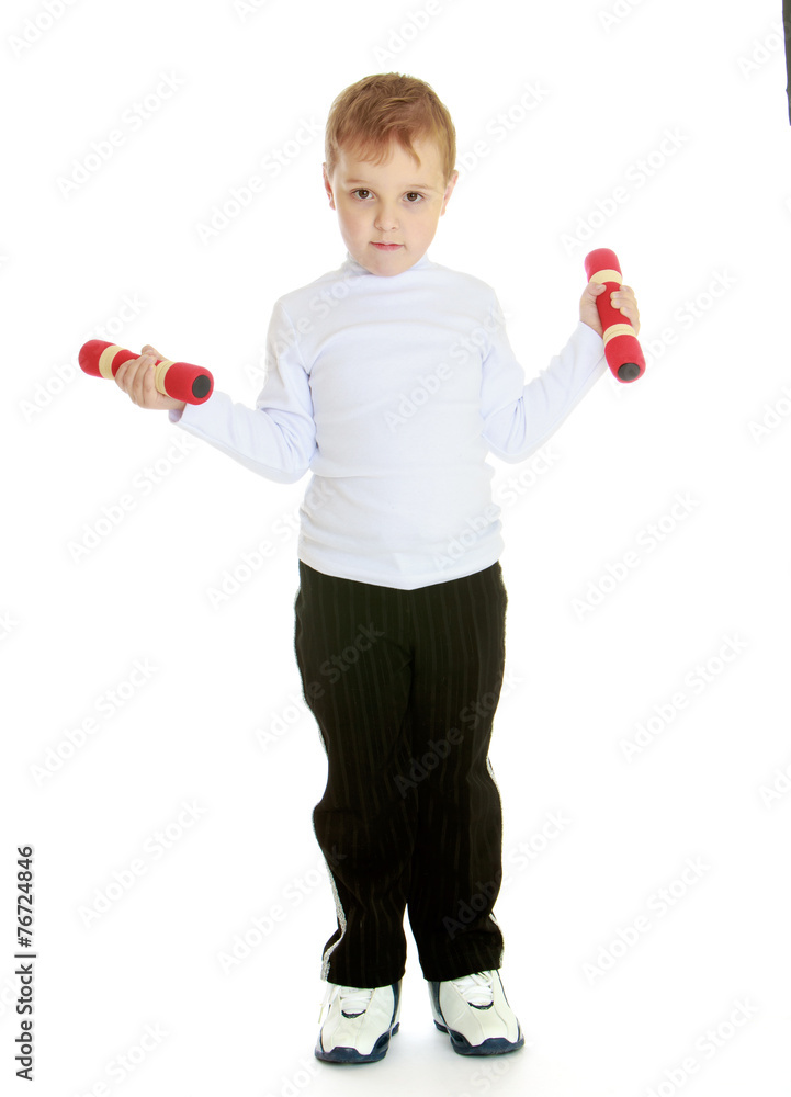 Little boy with dumbbells in his hands. Little boy with dumbbells in his hands.