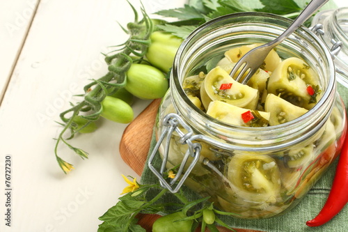 Homemade green tomatoes preserves in glass jar