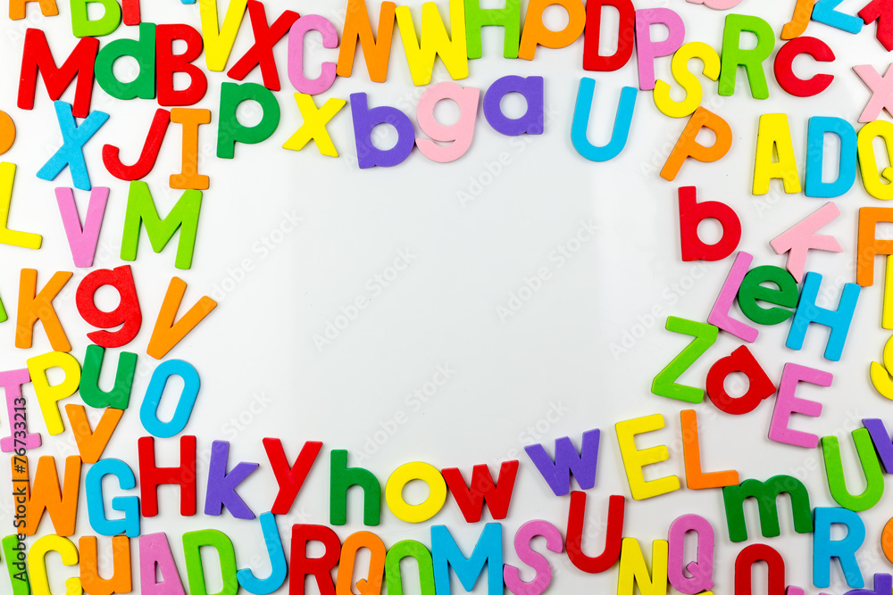 Alphabet magnets forming frame on whiteboard Alphabet magnets forming frame on whiteboard