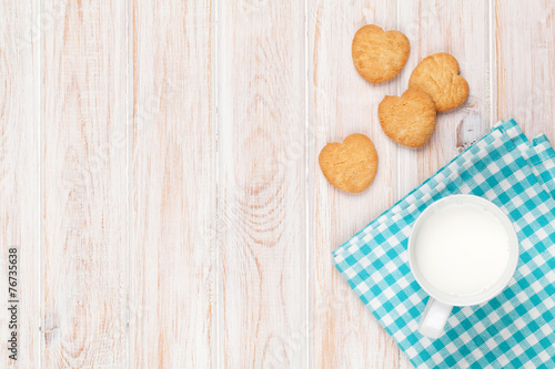 Cup of milk and heart shaped cookies